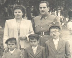Family portrait of parents with three young boys