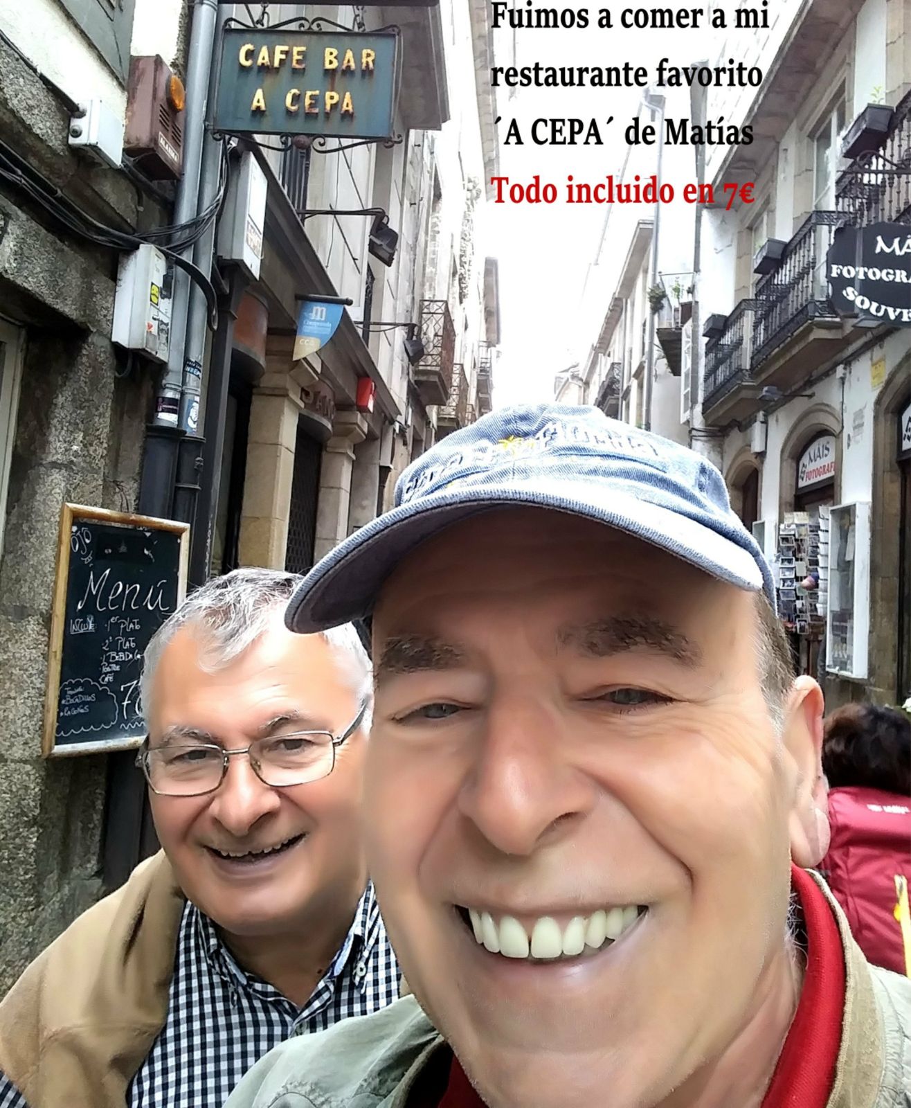 Selfie of Juan Xuna and a friend in a narrow old street, outside the restaurant A Cepa